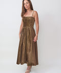 Army green midi dress with spaghetti straps, fitted bodice, and flowing skirt.