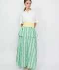 Green striped tiered midi dress with yellow waistband and white collared top.