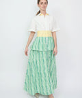 White short-sleeve collared top dress with yellow waistband and tiered green-striped skirt.