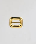 Rectangular gold metal belt buckle with rounded edges and central bar.