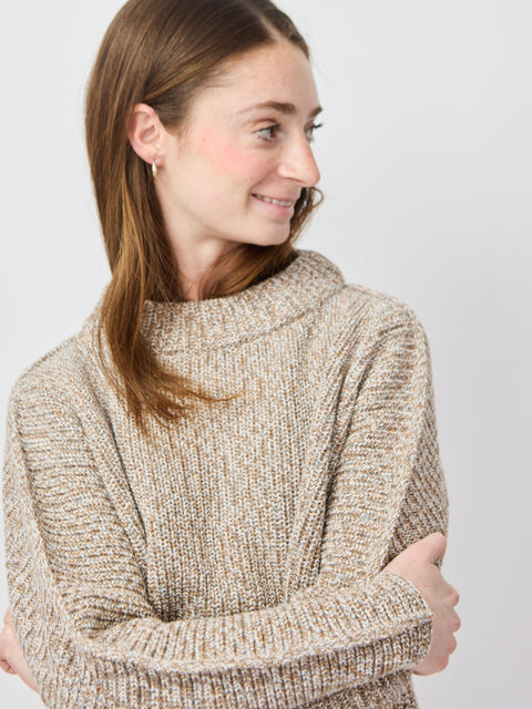 Light beige chunky knit sweater with relaxed fit and wide, cozy crew neckline.