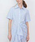 Blue and white striped shirt dress with short sleeves and gathered ruffle detail on front.
