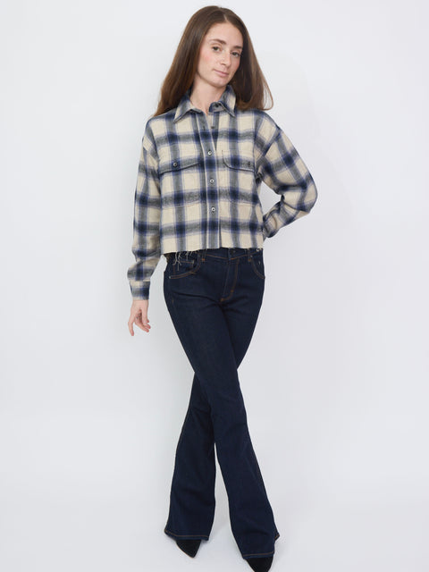 Purple and cream plaid flannel shirt with button-up front and long sleeves.