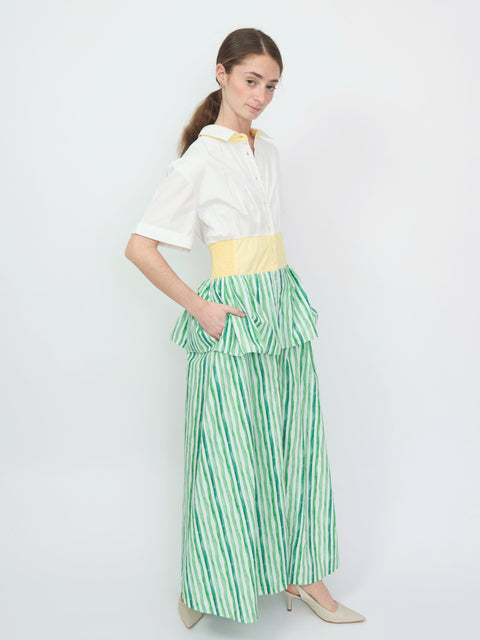 Green and white striped tiered maxi dress with yellow waistband and short-sleeve white top.