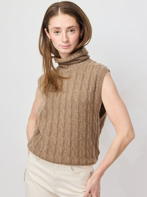 Sleeveless pecan brown cable knit turtleneck sweater with relaxed fit.