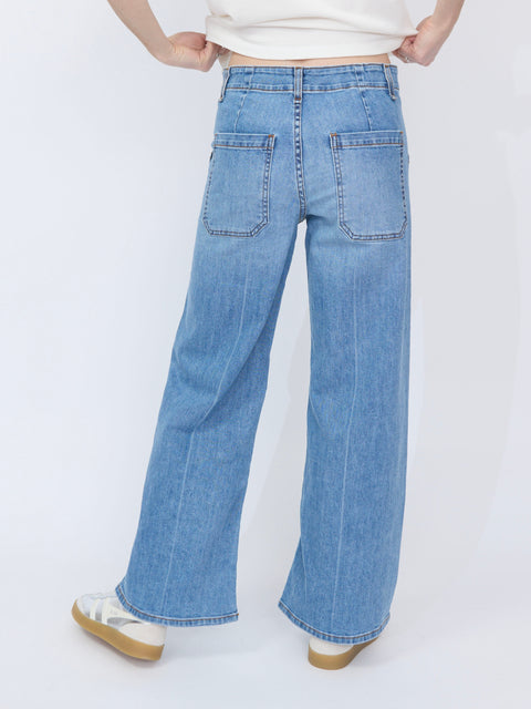 Light blue wide-leg denim jeans with high waist and large back pockets.