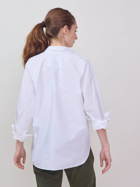 White long-sleeve button-up shirt with a classic collar and relaxed fit, shown from the back.