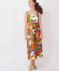 Woman wearing a colorful floral dress on a white background