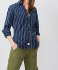 Navy blue button-up shirt with white textured vertical stripes and long sleeves.