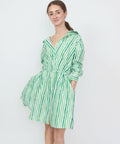 Green and white striped off-shoulder mini dress with long sleeves and a tiered skirt.