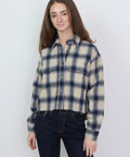Purple and cream plaid flannel shirt with button front and chest pockets, relaxed fit.