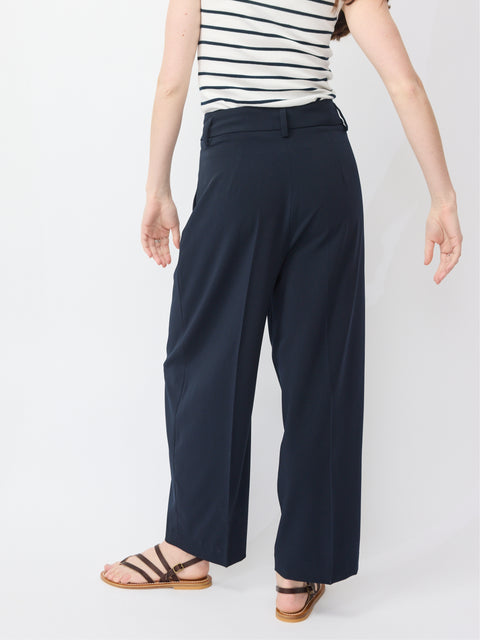 Navy wide-leg pants with high waist and belt loops, made from lightweight fabric.