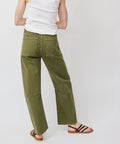 Olive green soft denim utility pants with a relaxed straight-leg fit and back patch pockets.