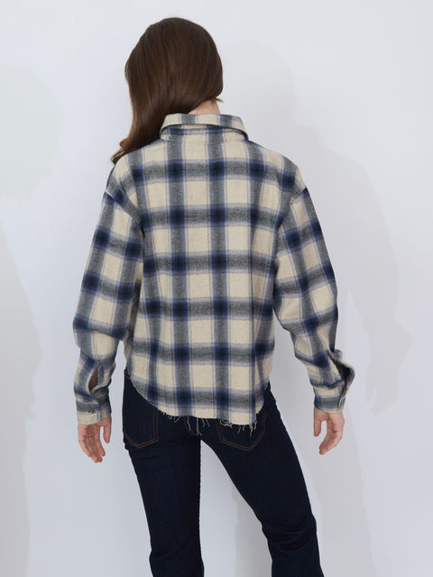 Purple and cream plaid flannel shirt with long sleeves and relaxed fit, shown from back.