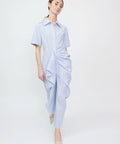 Light blue and white striped shirt dress with short sleeves and gathered ruffle detailing down the front.