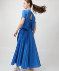 Blue pleated midi dress with short sleeves and keyhole back detail.