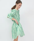 Green and white striped off-the-shoulder mini dress with puffed sleeves and cinched waist.
