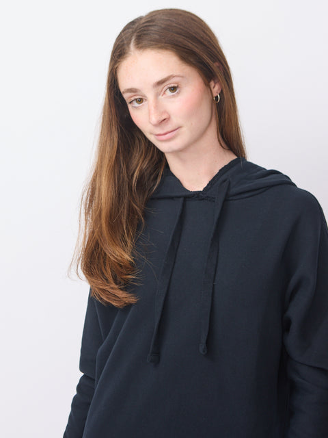 British navy dress with long sleeves, hoodie, and relaxed fit in soft fabric.