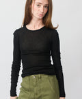 Black long-sleeve fitted Sadou t-shirt with crew neckline on model.