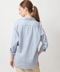 Blue and white vertical striped long-sleeve shirt with relaxed fit and buttoned cuffs.