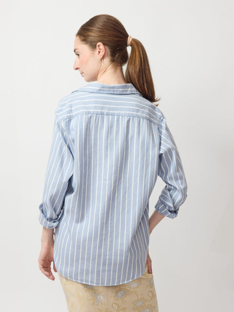 Blue and white vertical striped long-sleeve shirt with relaxed fit and buttoned cuffs.