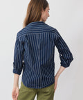 Navy blue textured stripe button-up shirt with long sleeves rolled to elbows, relaxed fit.